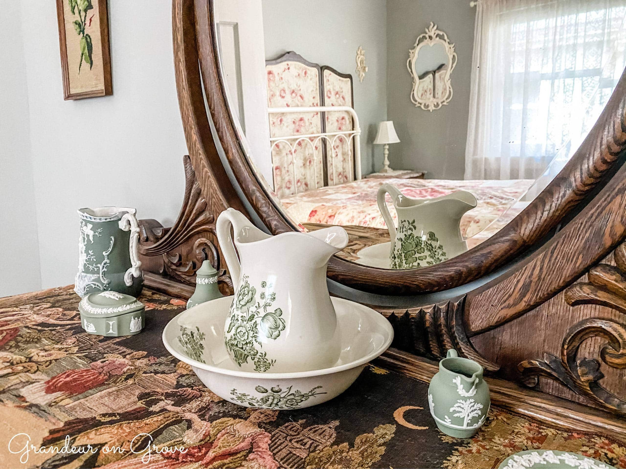 porcelain pieces atop a tapestry