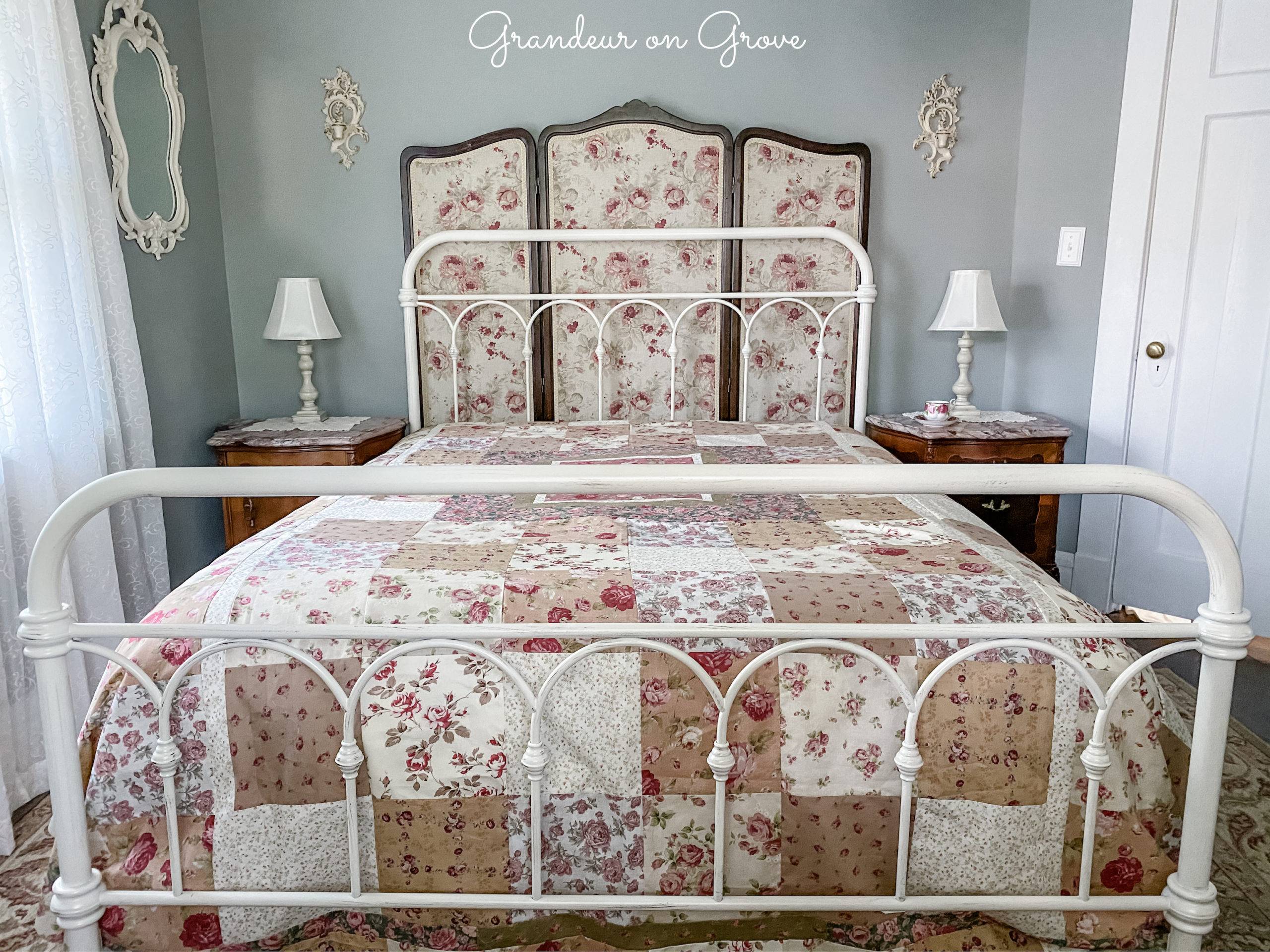 metal frame bed with rose quilt and screen