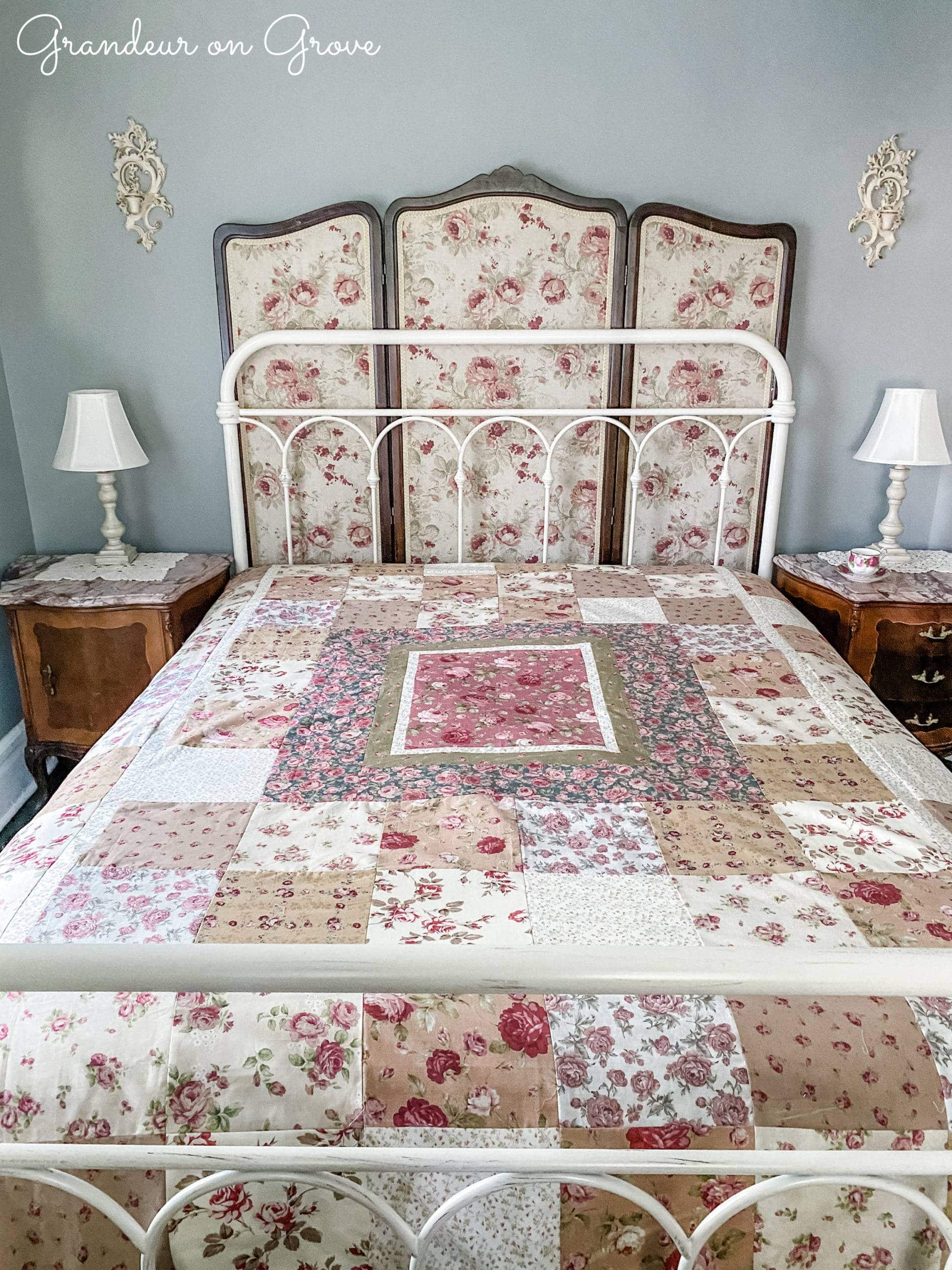 Metal frame bed with rose quilt and screen