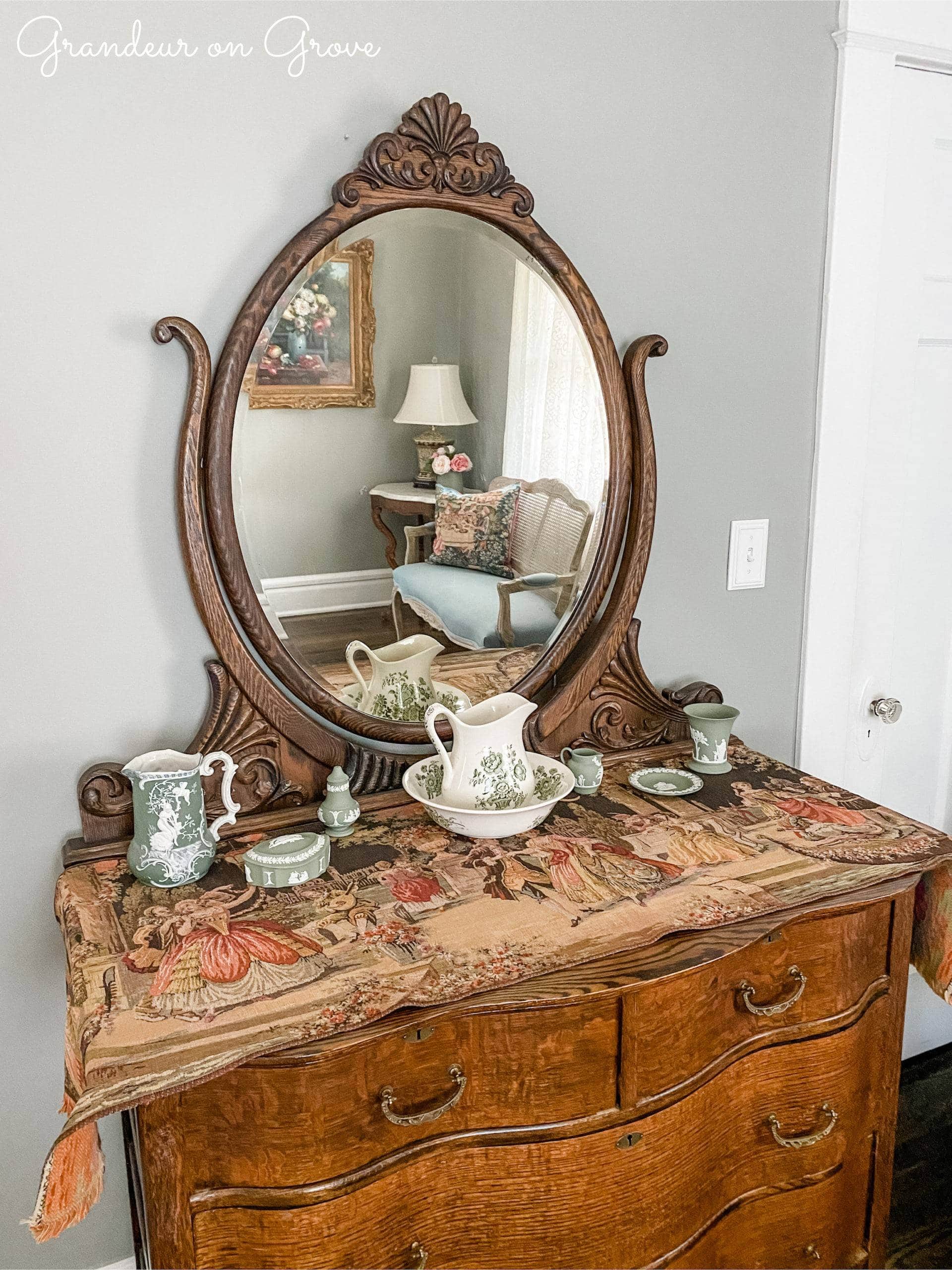 Wooden dresser with porcelain atop