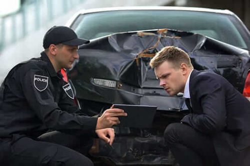 Police using ipad to access car accident