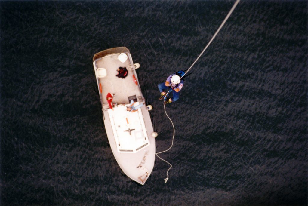 Helicopter: Eurocopter AS355 F1 TwinStar. Rappelling from a central positioned hoist system