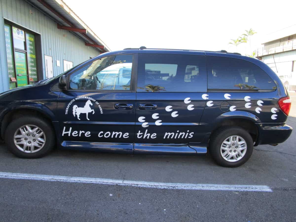 Custom vehicle graphics installed on a commercial van in Kona