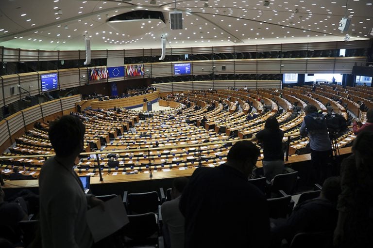 Sweden's Prime Minister Stefan Lofven, background center, addresses European Parliament members at the main chamber of the European Parliament in Brussels, Wednesday, April 3, 2019. (AP Photo/Francisco Seco)