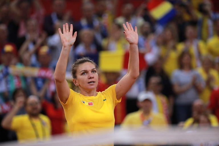 epa07519966 Simona Halep of Romania celebrates after winning her game against Caroline Garcia of France during the Fed Cup World Group, Semi Final between France and Romania, in Rouen, France, 21 April 2019. EPA/CHRISTOPHE PETIT TESSON