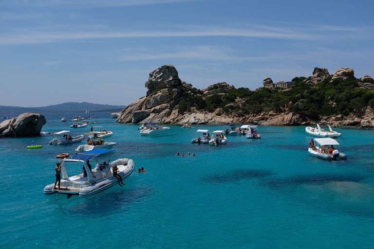 PALAU, ITALY - JULY 28: Boats float in turquoise water at Spiaggia di Cala Corsara beach on Isoli Sparggi island on July 28, 2018 near the island of Sardinia and Palau, Italy. Sardinia is a popular summer tourist destination. (Photo by Sean Gallup/Getty Images)