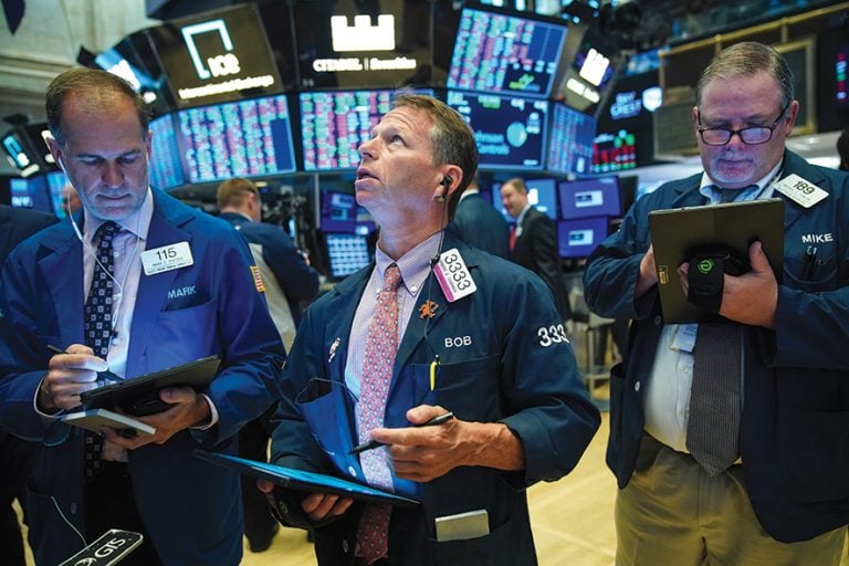 NEW YORK, NY - AUGUST 13: Traders and financial professionals work on the floor of the New York Stock Exchange (NYSE) at the opening bell on August 13, 2019 in New York City. The Dow Jones Industrial Average jumped up 400 points in early trading on Tuesday, led by Apple after the Trump administration said it will delay tariffs on some items, initially set to go into effect on September 1, until December 15. (Photo by Drew Angerer/Getty Images)