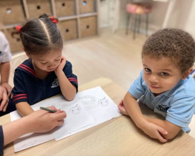 why_French_Immersion preschoolers working on a French assignment