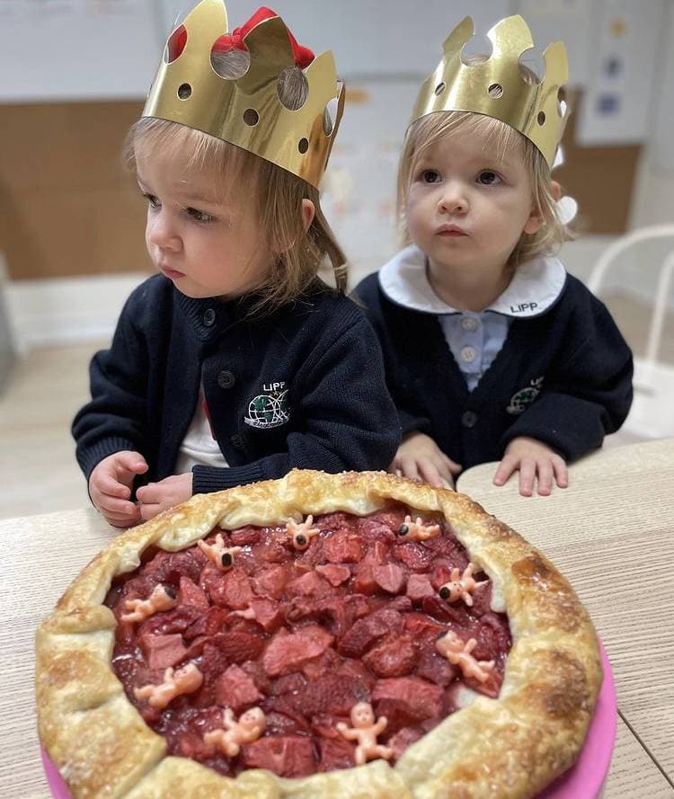preschool students with a pastry
