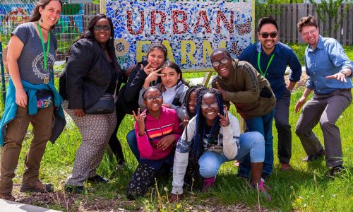 A group of students and adults at Badger Rock Urban Farm