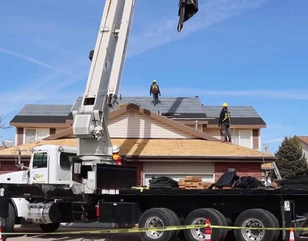 loading a roof with a crane loading a roof with a crane