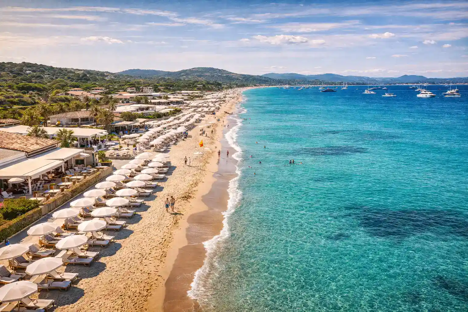 Saint-Tropez harbor with fishing boats and cafe terraces