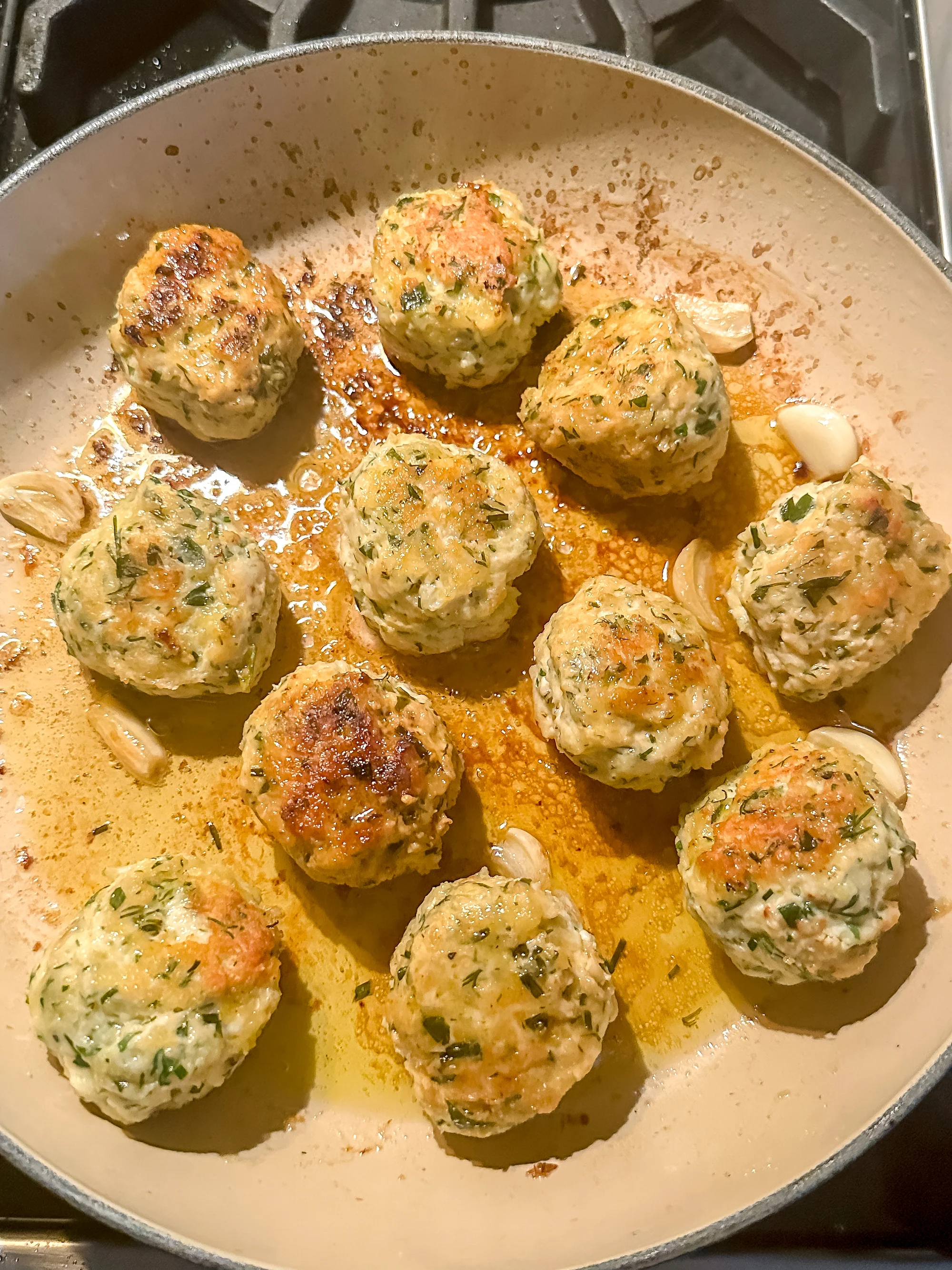 chicken balls cooking on the stove top