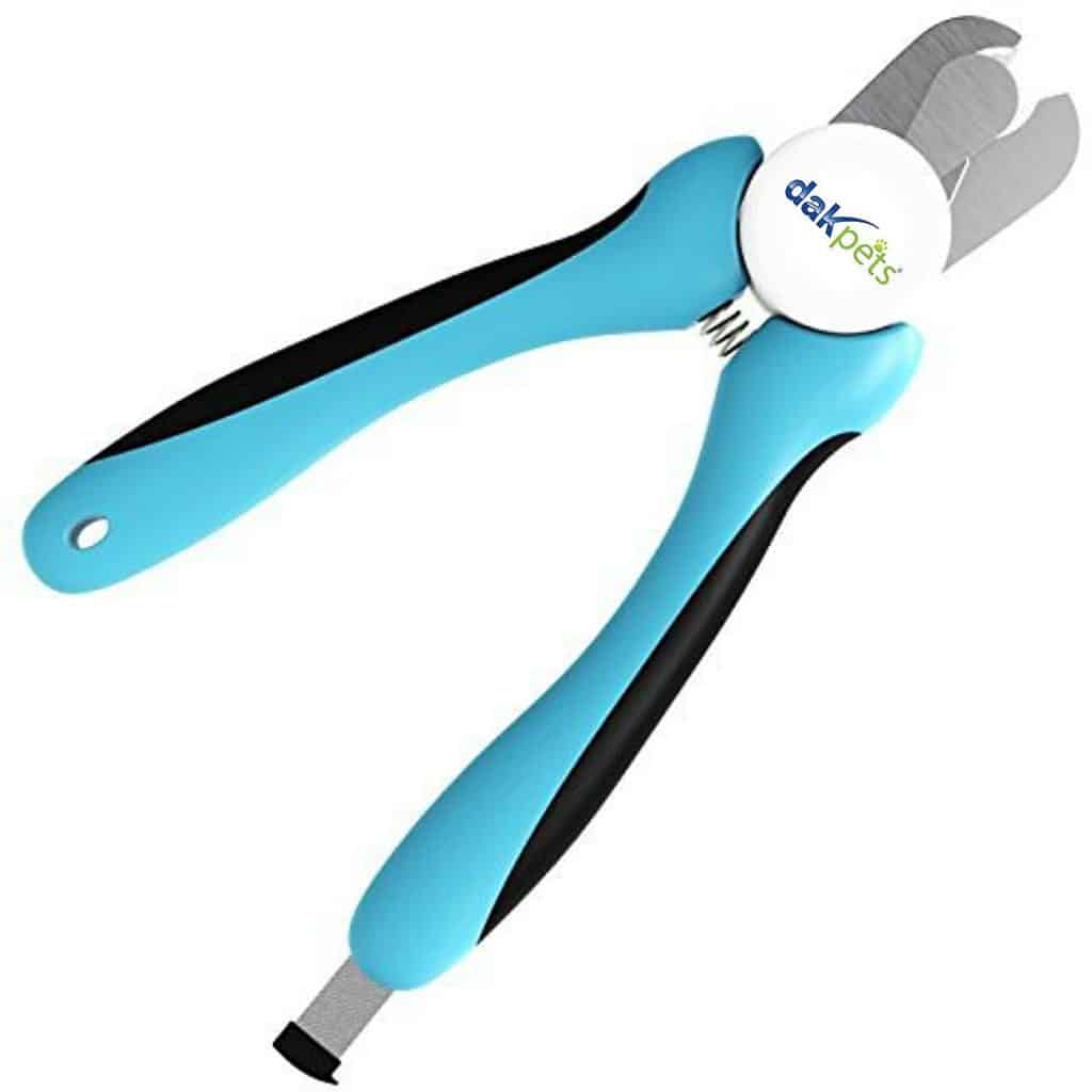 Green handled scissor style nail trimmers on white background