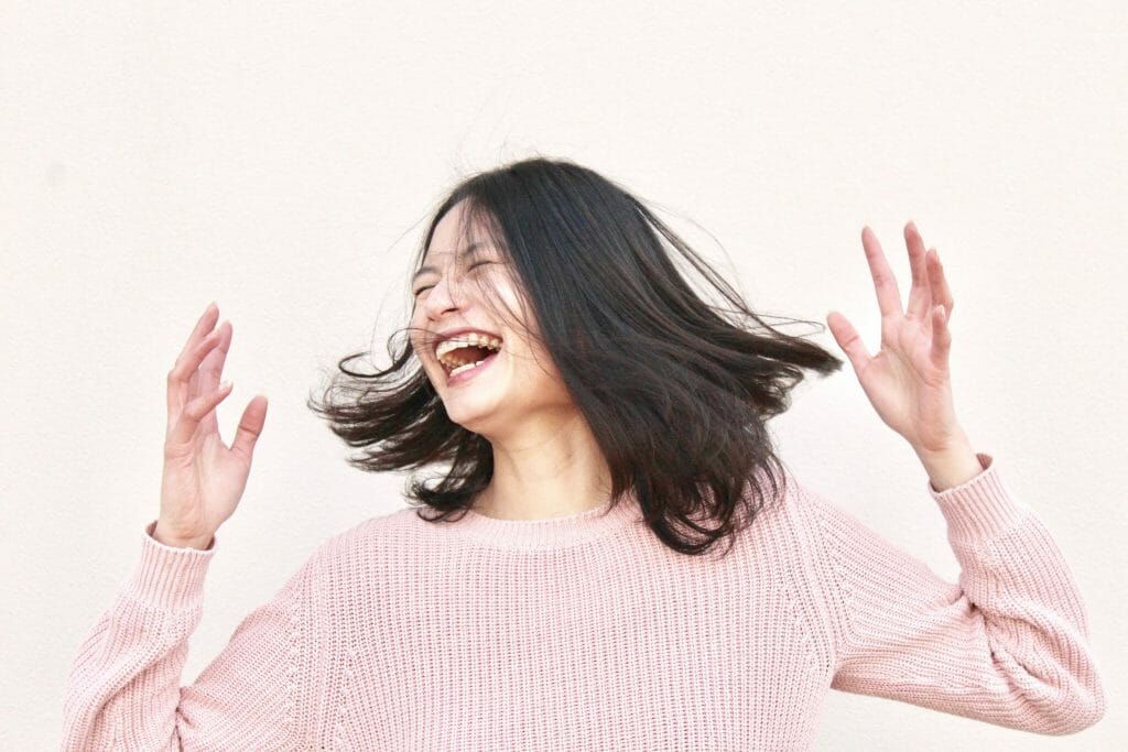 woman dancing after being approved for instant cash loans no credit check unemployed
