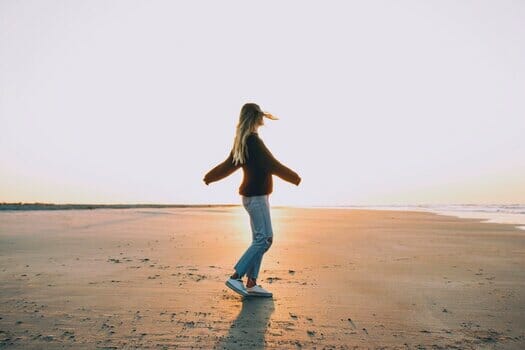 Woman walking happily after being approved for cash advance loans