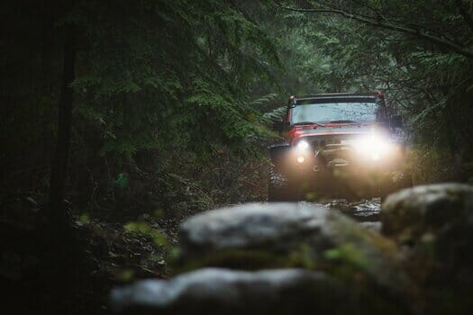 Car fitted with 4x4 tyres driving off-road