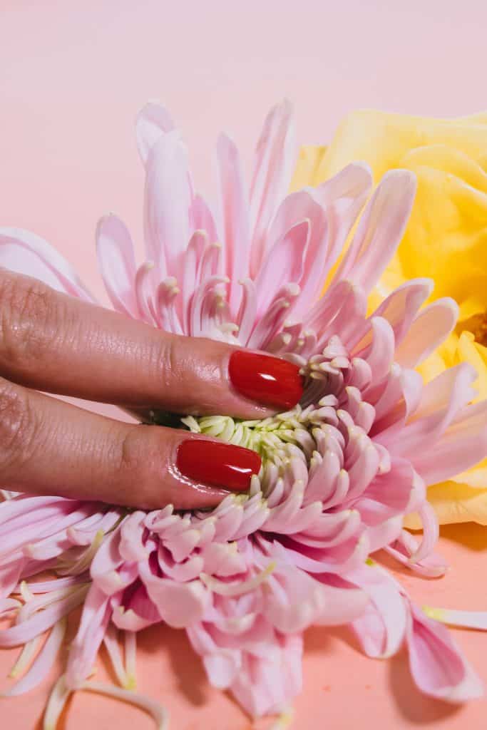 woman sensually touching a flower