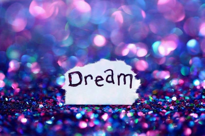 the word "dream" on sequins