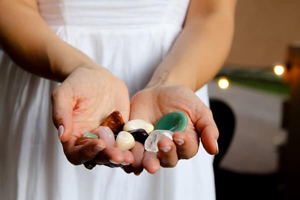 woman holding crystals