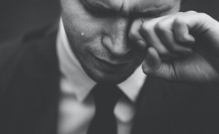 man in suit stressed