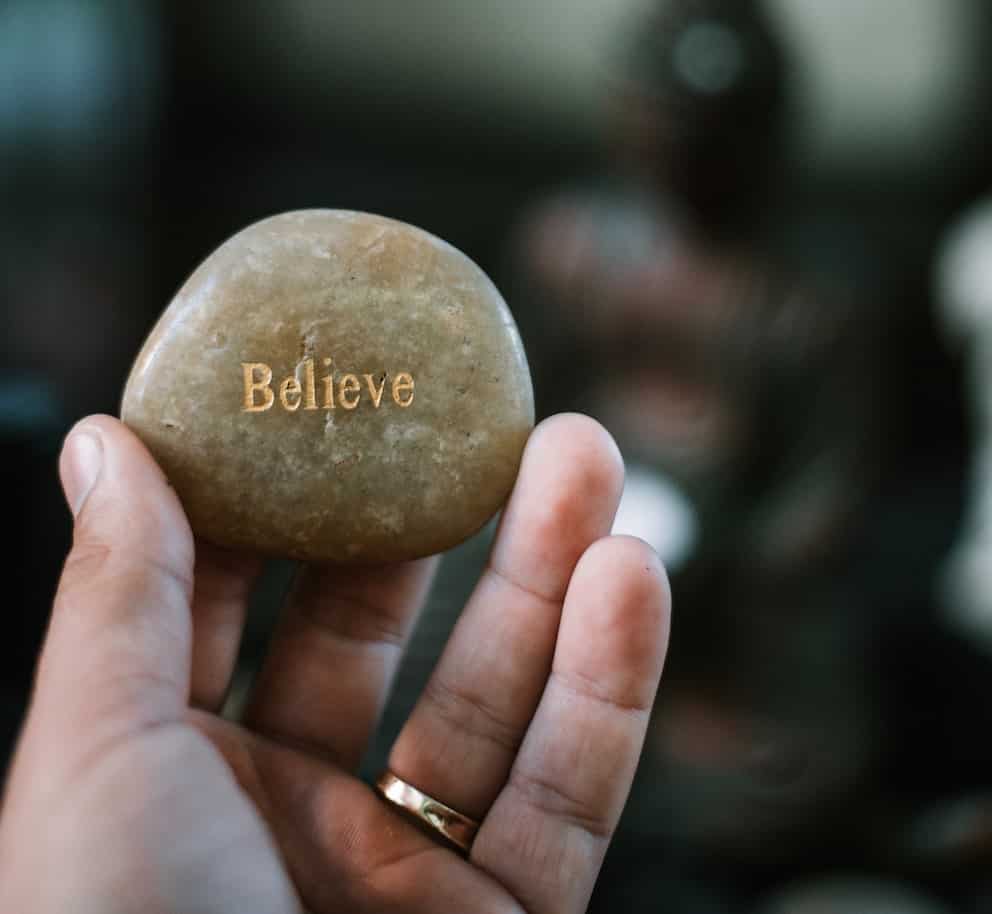 stone with the word believe engraved