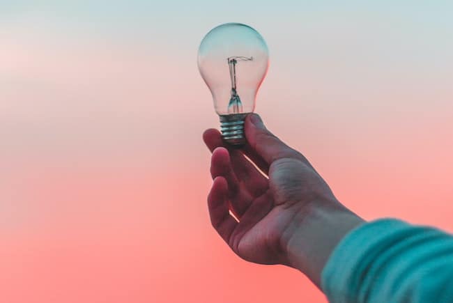 person holding lightbulb