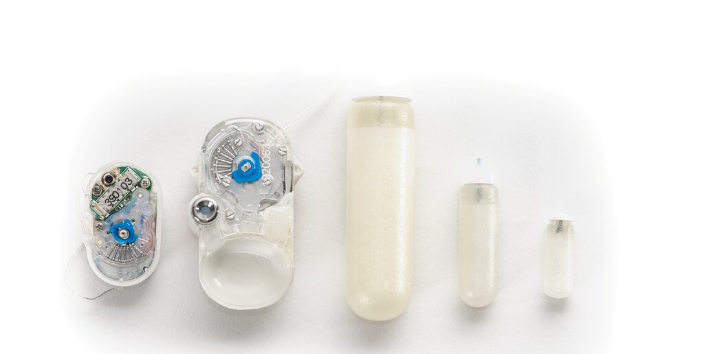 five implantable pumps representing the five sizes that are offered