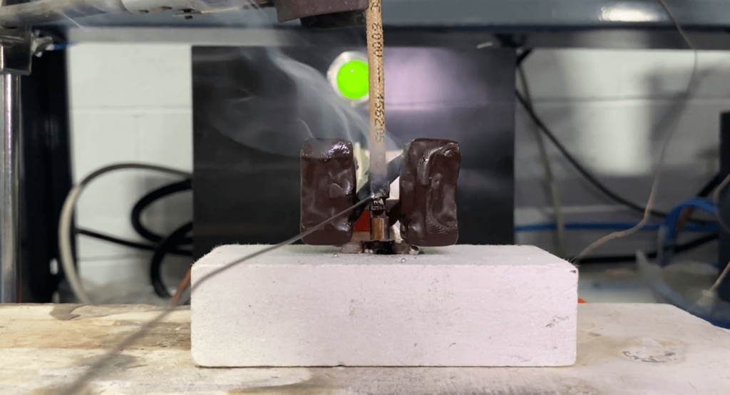 Induction soldering of an AC wire cable with wire feeder