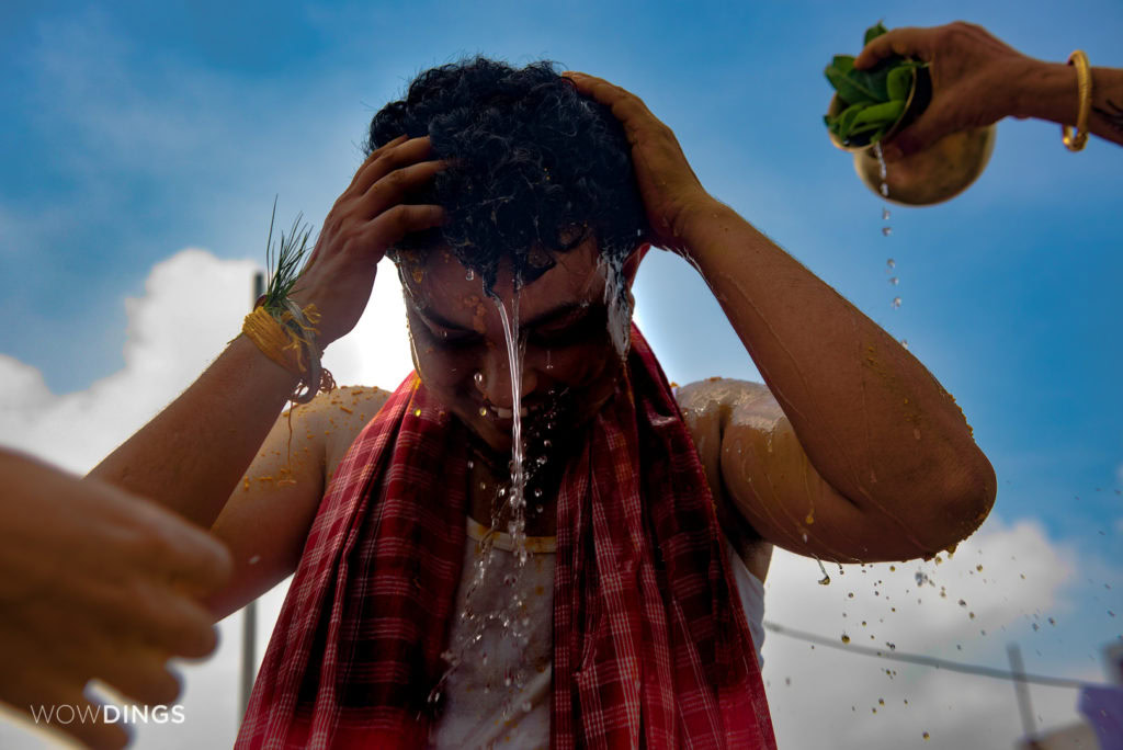 Dipan following the traditional bengali ritual of Haldi at his home 