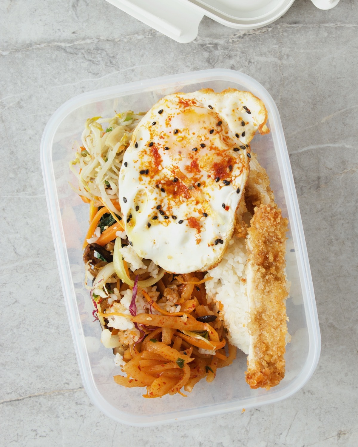 Bibimbap in open airtight container