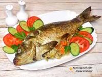 Карп запеченный в духовке с рисом и грибами
