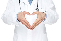 Doctor showing heart shape with hands