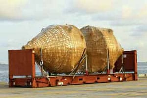 Oversized wrapped cargo sitting on a port dock