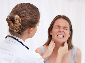 Doctor examining jaw pain