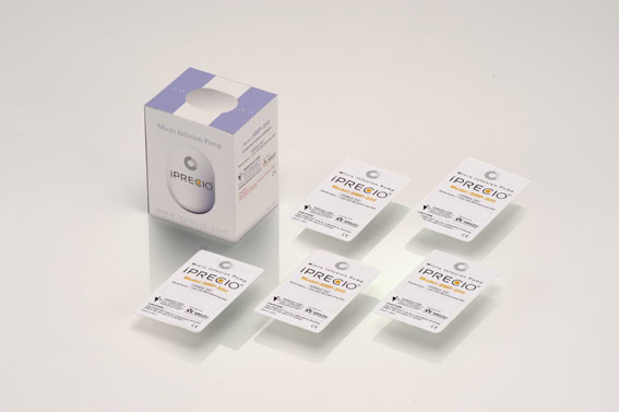 box for iPRECIO SMP-200 with the five pump blister packs laid next to it
