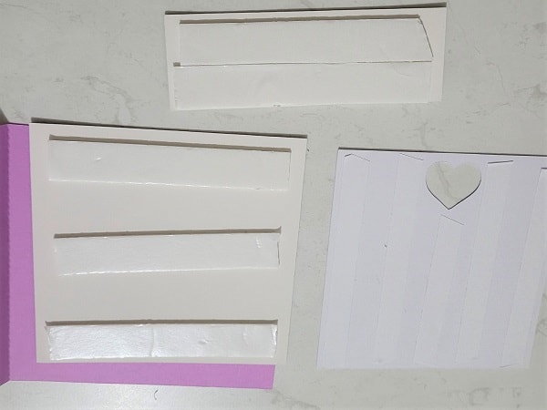 double sided tape and foam tape on the back of the components of the T-Shaped thank you card ready to construct the card.