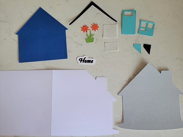 Here are all the pieces of the house and card cut out ready to put together