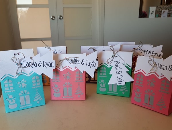 Lots of Brother Christmas House Boxes ready for Christmas gifts.