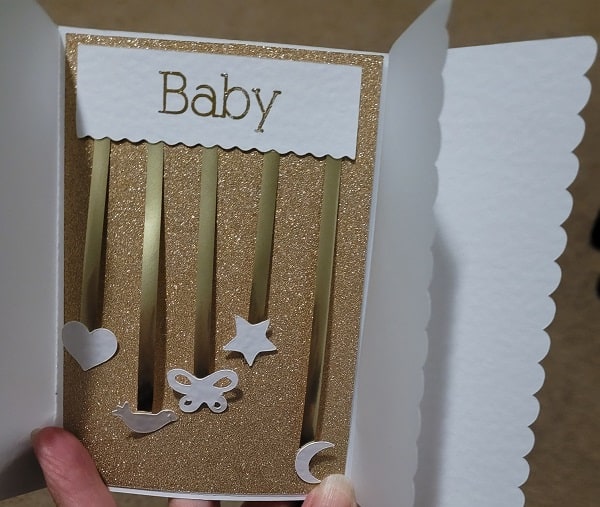 Inside of the quick baby card using gold glitter cardstock, gold foiled writing and vellum to make it extra special.