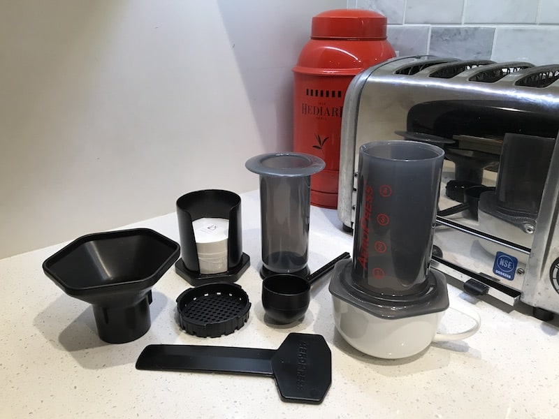 AeroPress parts laid out on a counter