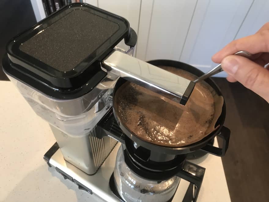 Stirring coffee grounds in Moccamaster brew basket