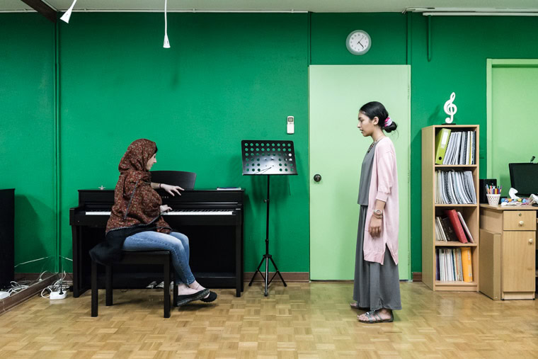 ranian female vocalist Sayeh giving vocal lesson to a young girl at her own music school.