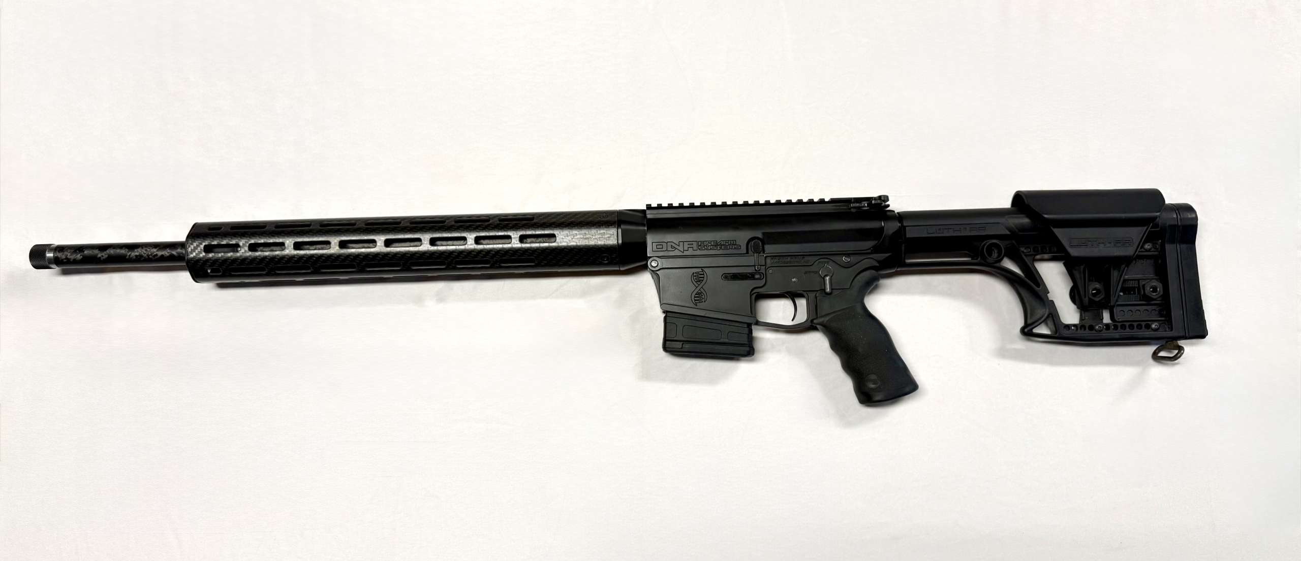 DNA Firearm Systems Omega Carbon Fixed 243 Rifle