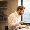 businessman coffee phone laptop