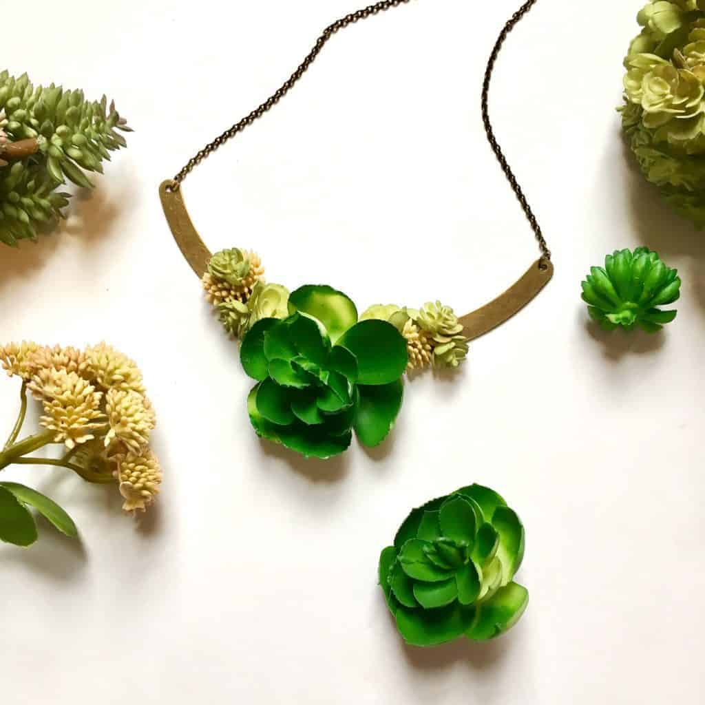 succulent necklace on a white table
