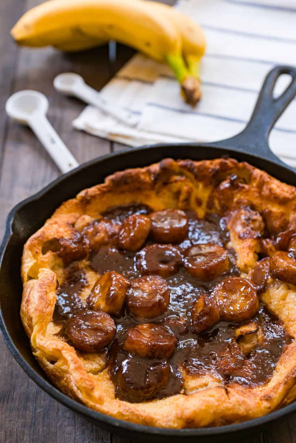 Bananas Foster Dutch Baby Bananas Foster Dutch Baby. An easy and decadent brunch with crisp buttery puffs of pancake covered in a cinnamon caramel sauce, and bananas flambeed with dark rum.