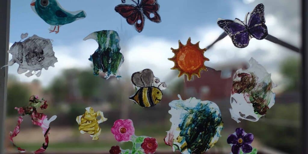 Picture of summer themed DIY window clings stuck to a back door