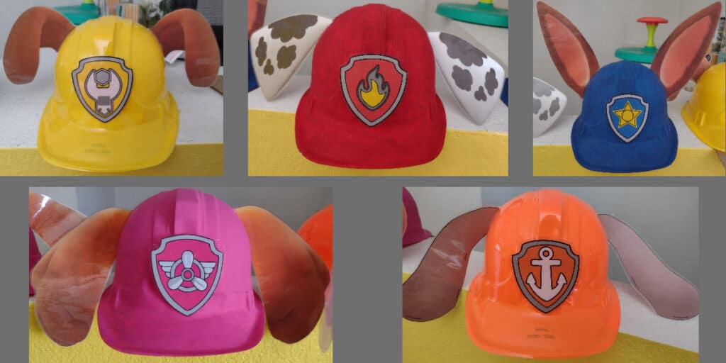 Picture of Rubble, Marshall, Chase, Skye, and Zuma Paw Patrol hats made from painted plastic construction helmets
