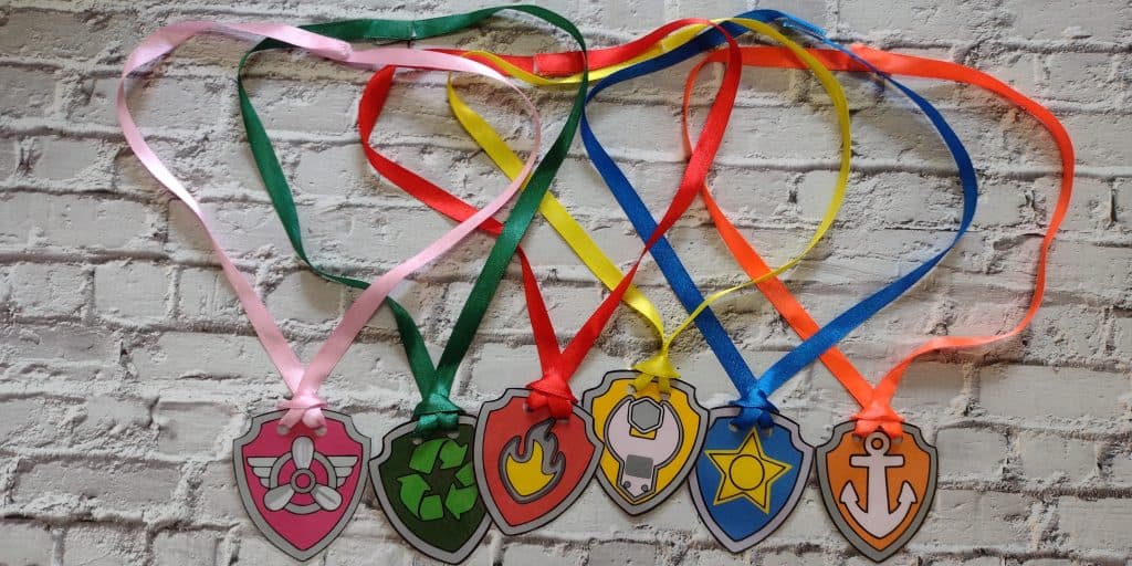 Picture of Skye, Marshall, Rubble, Rocky, Marshall, and Zuma Paw Patrol badge ribbon necklaces